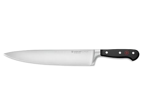 Wusthof Classic 10" Chef's Knife | Ergonomic handle reduces hand strain, while the tapered bolster offers a comfortable pinch grip for precise dicing.