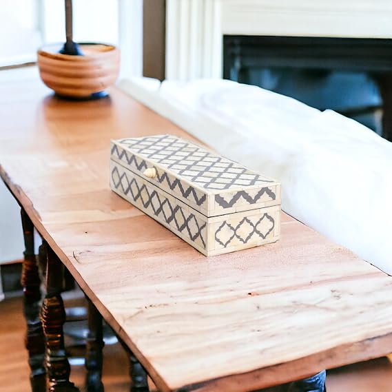 Gray and white long rectangle bone inlay box with geometric pattern.